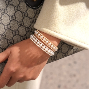 Three-layer faux pearl beaded bracelet with rhinestones in gold and silver finish