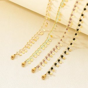 Golden chain necklaces with colorful resin teardrop charms in a minimalist summer style