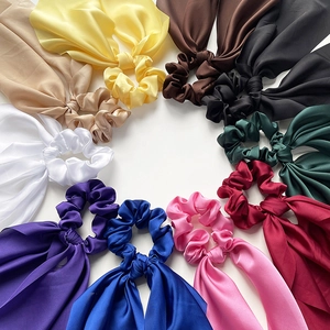 Elegant multi-color satin hair scrunchies with long ribbons on a clean white background