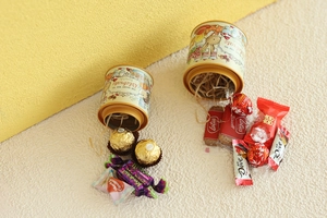 Detailed top view of rabbit illustration on mini tin box with celebrate slogan