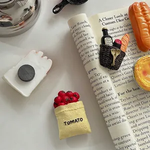 3D creative food resin fridge magnets featuring tomato and bread on a warm table