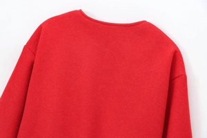 Detail of soft red bomber jacket collar and textured wool-like fabric back view
