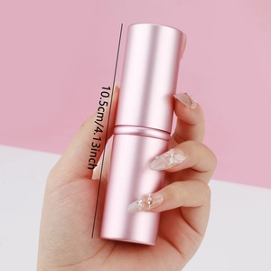 Macro shot of a pink metallic portable makeup brush with 10.5cm height dimension