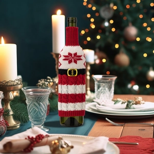 Christmas knitted wine bottle cover featuring red and white stripes and holiday pattern detail.
