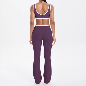 Purple yoga set with racerback bra and high-waisted flared leggings featuring white trim