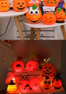 Close-up of glowing plastic Jack-o'-lantern lights with wizard hats and warm LED glow