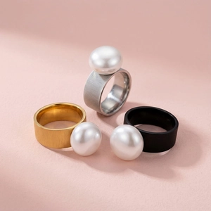 Modern hammered stainless steel rings in gold, silver and black with large pearls