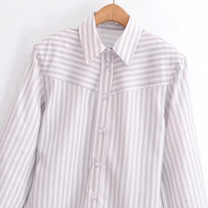 Women's grey and white vertical striped long sleeve shirt with padded shoulders and pointed collar