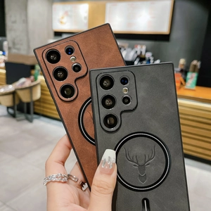 Close-up of brown and black leather cases with deer head and MagSafe magnetic rings
