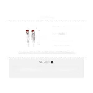 Close-up of red dome earrings with silver tassel fringe and size chart details