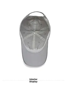 Detailed interior of a grey baseball cap showing reinforced seams and air vents