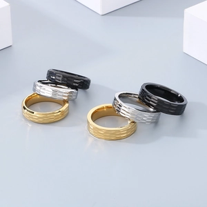 Minimalist titanium steel ring set with hammered texture in black, silver and gold