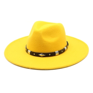 Detail of yellow wool fedora hat with black studded leather band and wide brim