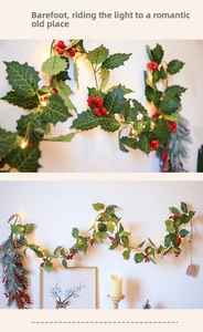 Detail of Christmas garland with red berries and warm LED lights for festive decor