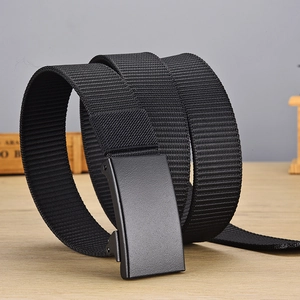 Detail of black nylon tactical belt featuring a matte alloy buckle and woven texture