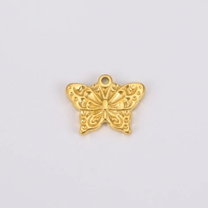 Macro detail of golden butterfly charm with intricate hollow texture and hanging ring