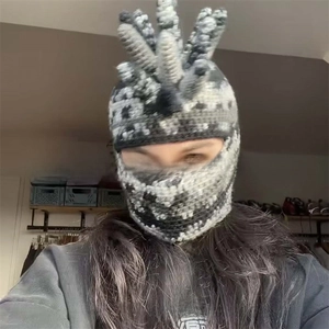 Detail of handmade crochet balaclava featuring unique five-pillar textured top design