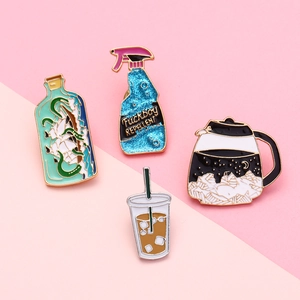 Creative enamel pins set featuring a green bottle, coffee pot, and spray bottle design