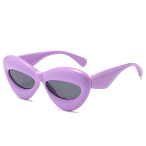 Chunky lavender purple cat-eye sunglasses with thick bubble frames and dark lenses