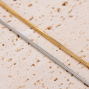 Minimalist square snake bone chains in gold and silver finish with detailed metal texture