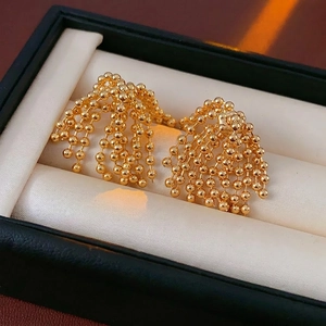 Elegant gold plated fireworks tassel earrings featuring polished beads in a luxury style