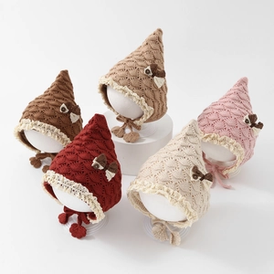Detailed knit texture and lace trim on baby bow hats in five soft autumn colors