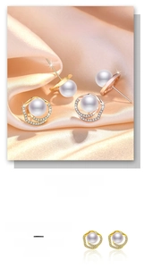 Hypoallergenic gold plated pearl earrings with zircon detail on champagne silk background