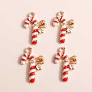 Set of four gold Christmas candy cane charms with red enamel and rhinestone bows