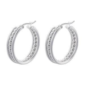 Detailed view of silver twisted hoop earrings with a vintage cable texture design