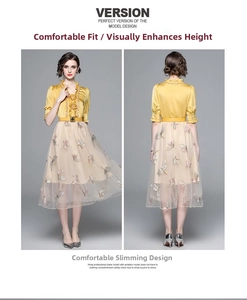 Detail of French style two-piece set featuring butterfly embroidery and gold silk blouse