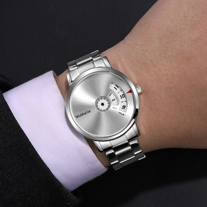 Detailed close-up of the rotating dial and silver steel band on the quartz watch