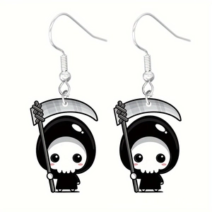 Detailed close-up of cute cartoon Grim Reaper acrylic earrings with silver hooks