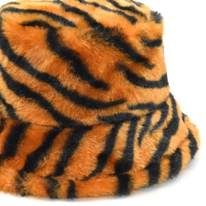 Plush faux fur bucket hat featuring a bold orange and black tiger print for winter warmth