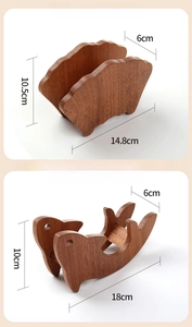 Detailed view of fan-shaped and fish-shaped ebony wood heat-resistant pot pads