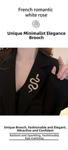 Golden snake brooch with textured scales displayed on a black blazer jacket