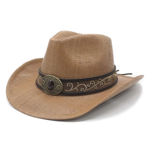 Close-up of a brown straw cowboy hat with a decorative faux leather band and metal buckle