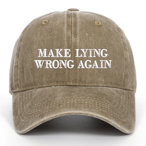 Detail of white embroidery Make Lying Wrong Again on washed khaki cotton baseball cap