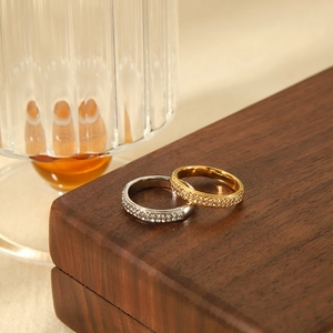 Luxurious 18K gold and silver stainless steel rings set with zircon rows on wood box