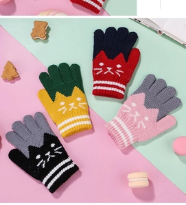 Detail of colorful knit jacquard cat gloves for kids with cozy thick lining