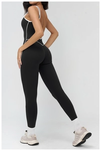 Detail showing the large open back design and contrast piping on the yoga jumpsuit