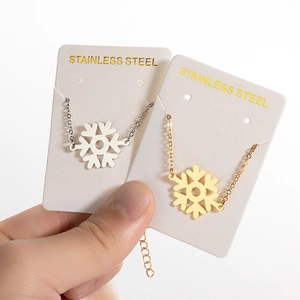 Minimalist stainless steel snowflake pendant necklace in elegant gold and silver finishes