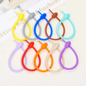 Close-up of colorful 21cm multipurpose silicone ties for cables and DIY accessories