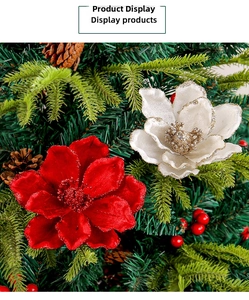 Macro shot of red and white velvet Christmas flowers with gold glitter and pine cones