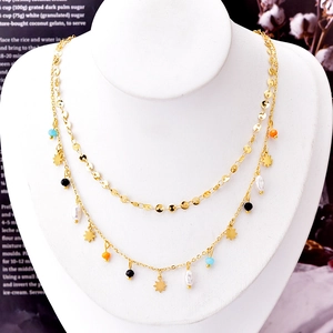 Double-layered 18k gold plated titanium necklace with stars, pearls, and colorful beads
