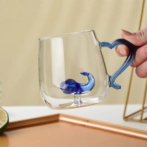 Creative glass mug featuring a 3D blue dolphin inside and a matching blue handle