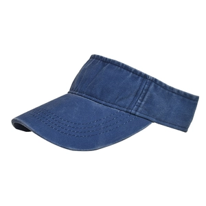 Detail of washed denim sun visor with reinforced stitching and distressed vintage finish