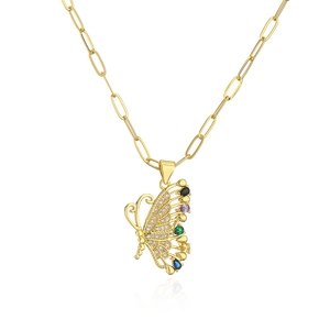 Macro shot of gold butterfly necklace with zircon stones and colorful gems on paperclip chain