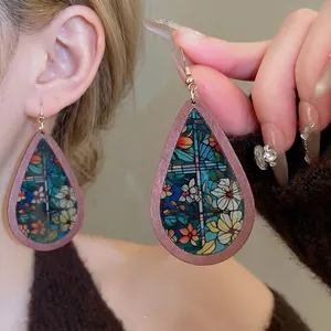 Ethnic teardrop earrings with floral print and vintage gold metal ear hooks