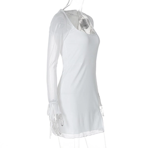 Detail of sheer mesh long sleeves with drawstring ties and ruffled cuffs on white dress