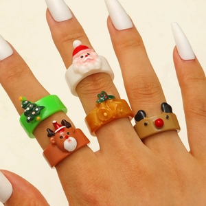 Detailed close-up of a 6-piece Christmas ring set featuring cute deer and tree motifs
